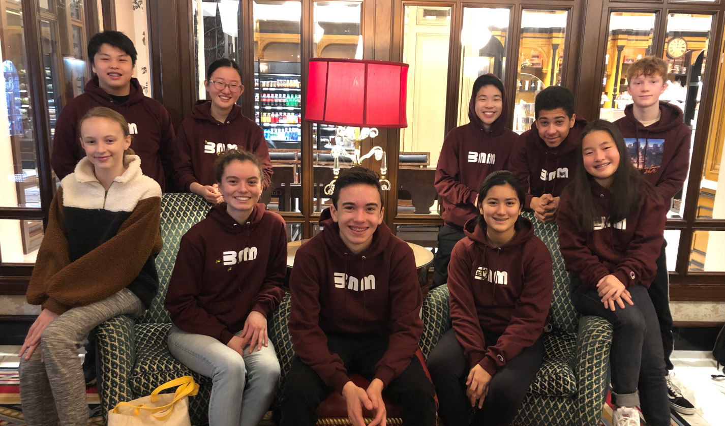 BAM students in maroon sweatshirts
